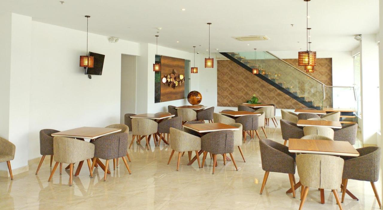 Hotel Royal Elim International Cali Εξωτερικό φωτογραφία The interior of the restaurant