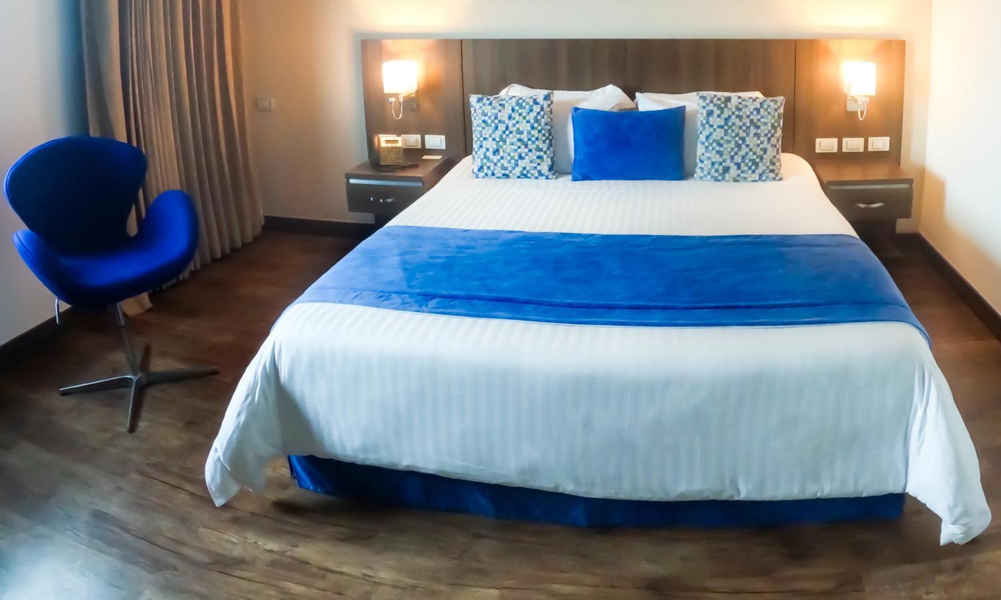 Hotel Royal Elim International Cali Εξωτερικό φωτογραφία A bedroom at the hotel